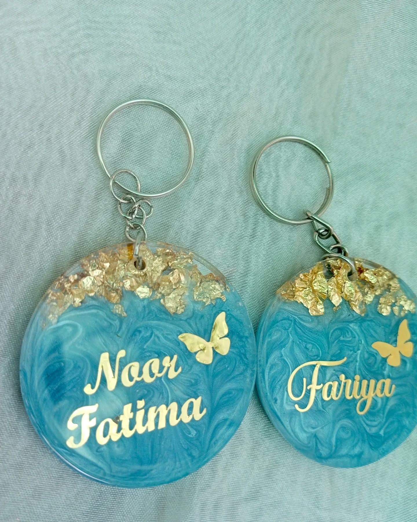 Handmade round resin keychain with glitter and custom name – personalized gift India