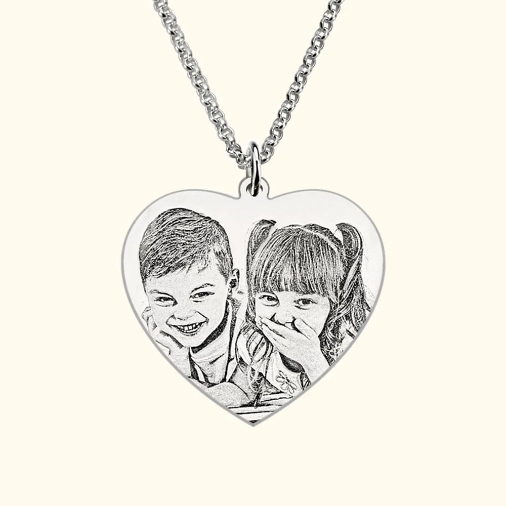 Close-up of photo engraved pendant – personalized metal charm