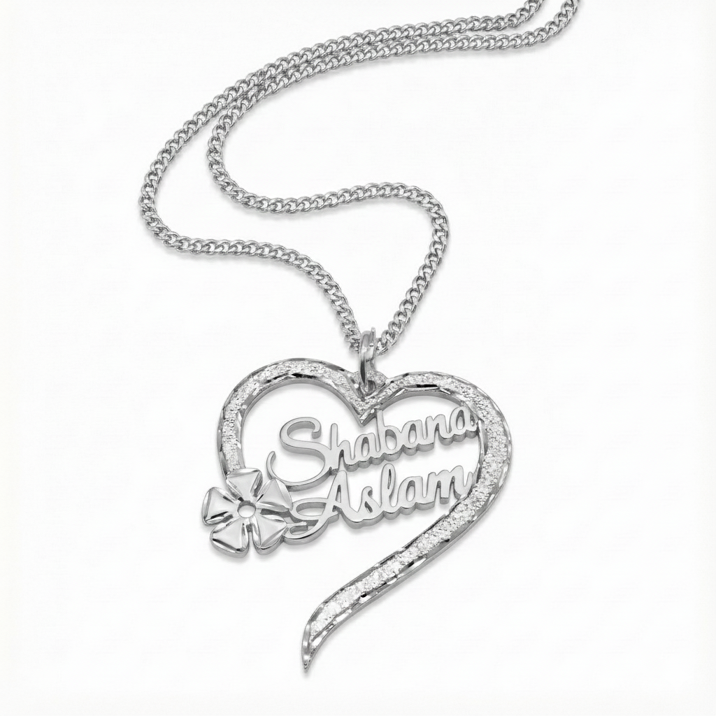 Sparkling heart-shaped flower pendant with 18-inch silver chain.