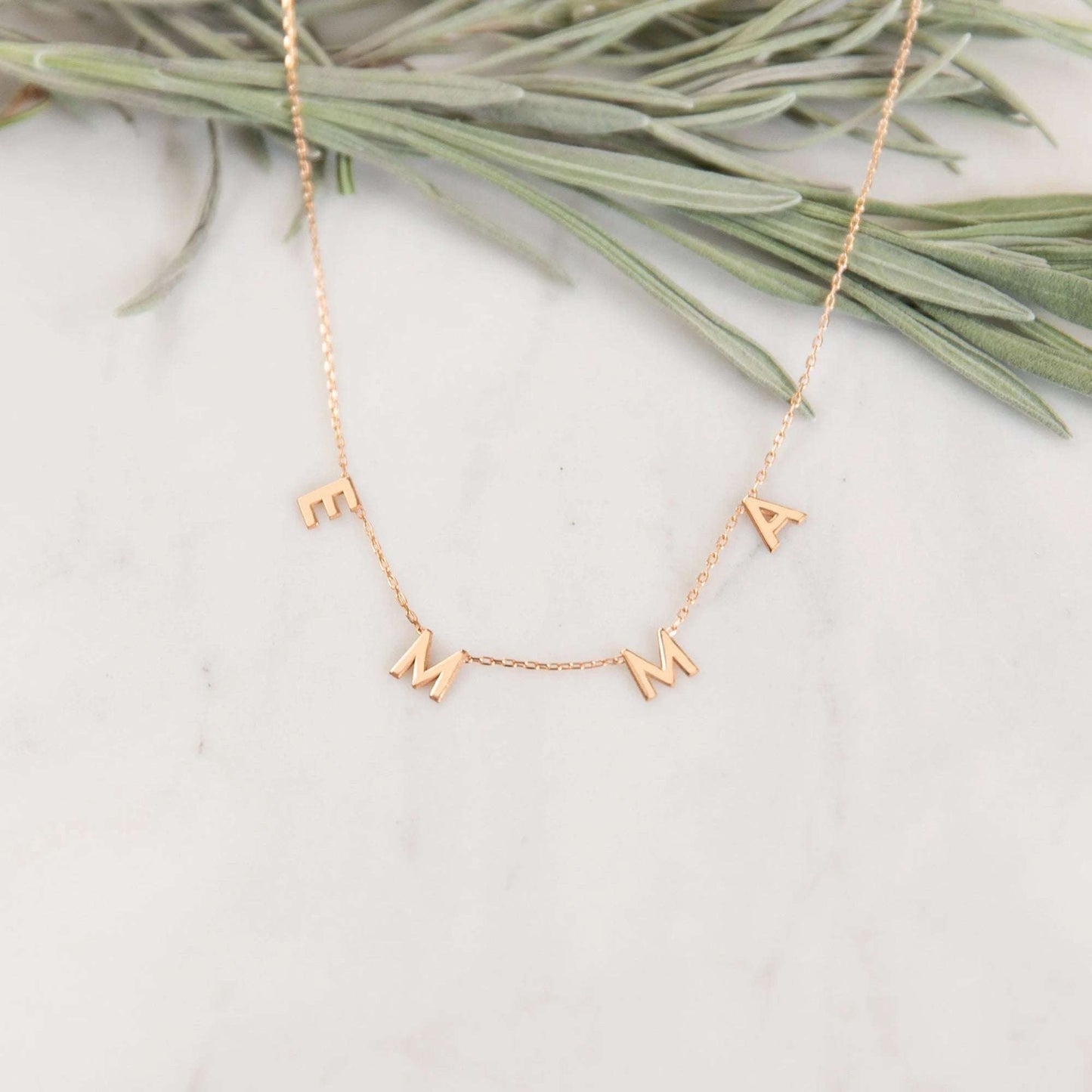 Rosegold letter pendant necklace with delicate design