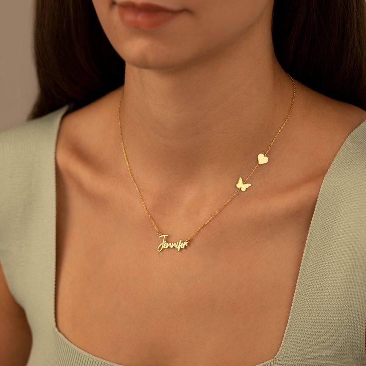 Custom engraved heart and butterfly necklace on delicate gold chain, ideal personalized gift