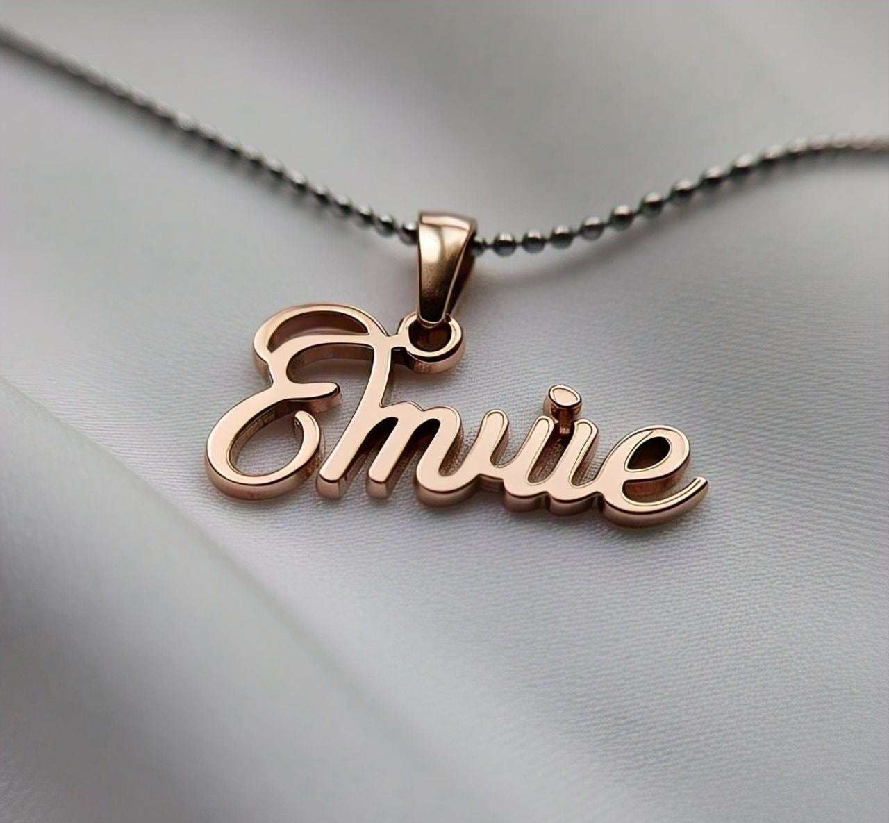 Side view of luxury pendant with engraved name, detailed finish