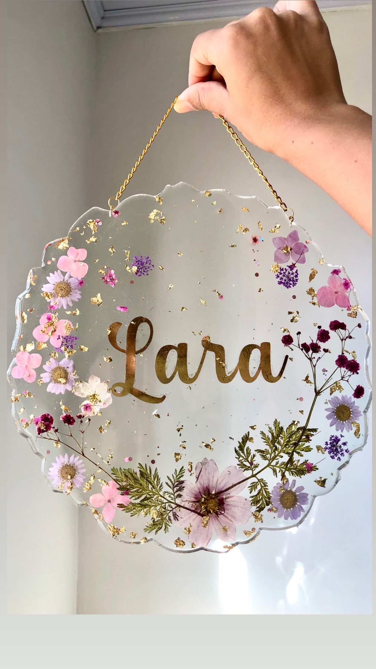 Handcrafted resin charm name frame personalized with your chosen name, pearls, flowers, and glitter. Perfect keepsake or gift for birthdays and anniversaries. Handmade in Vasai-Virar, Maharashtra. Free shipping India-wide!