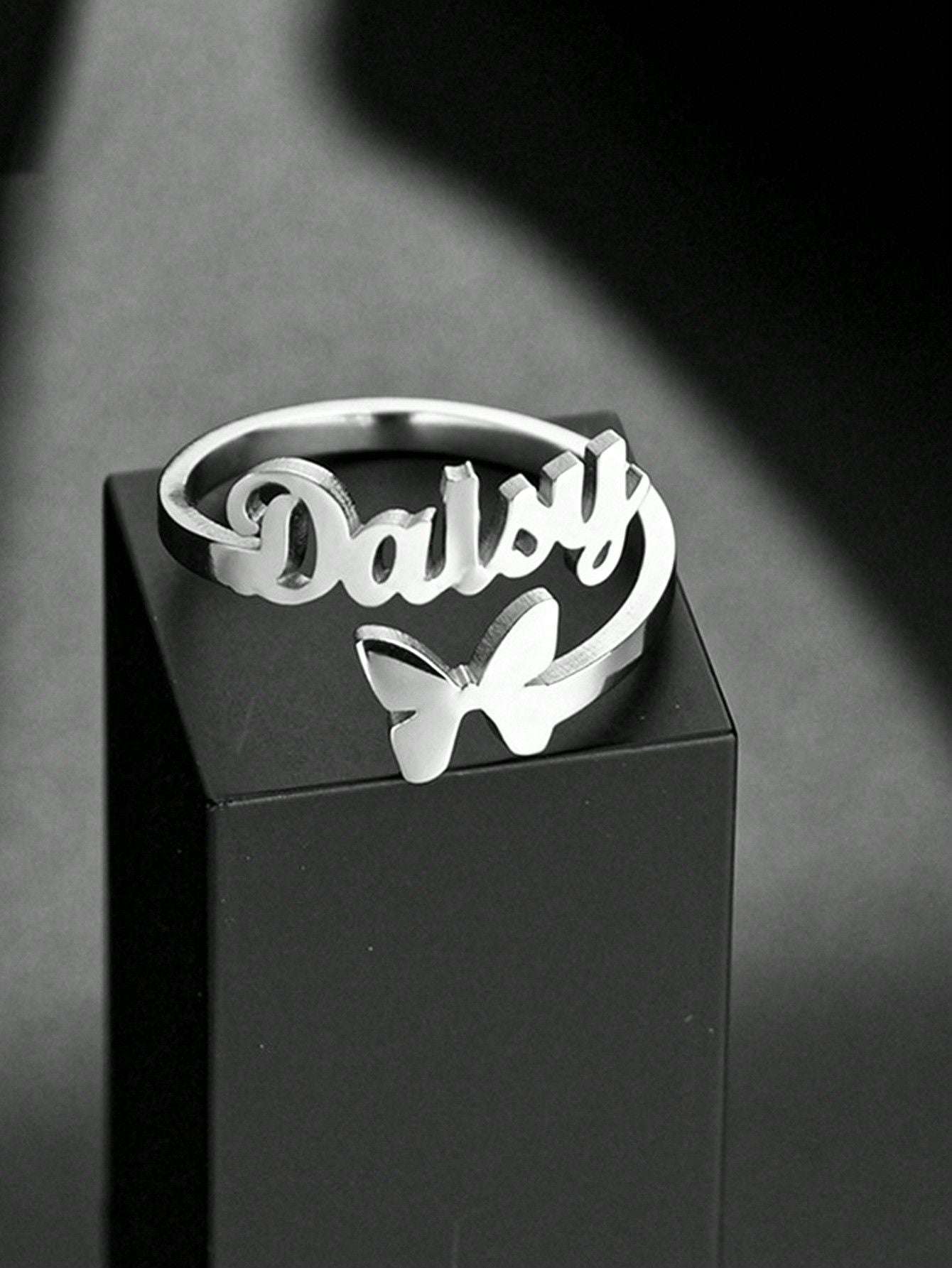 Custom butterfly name ring, silver band, KraftedKey close-up