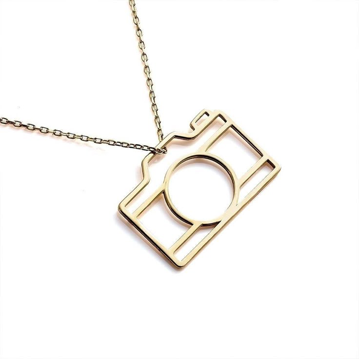 Close-up of unique camera charm pendant necklace showcasing intricate design