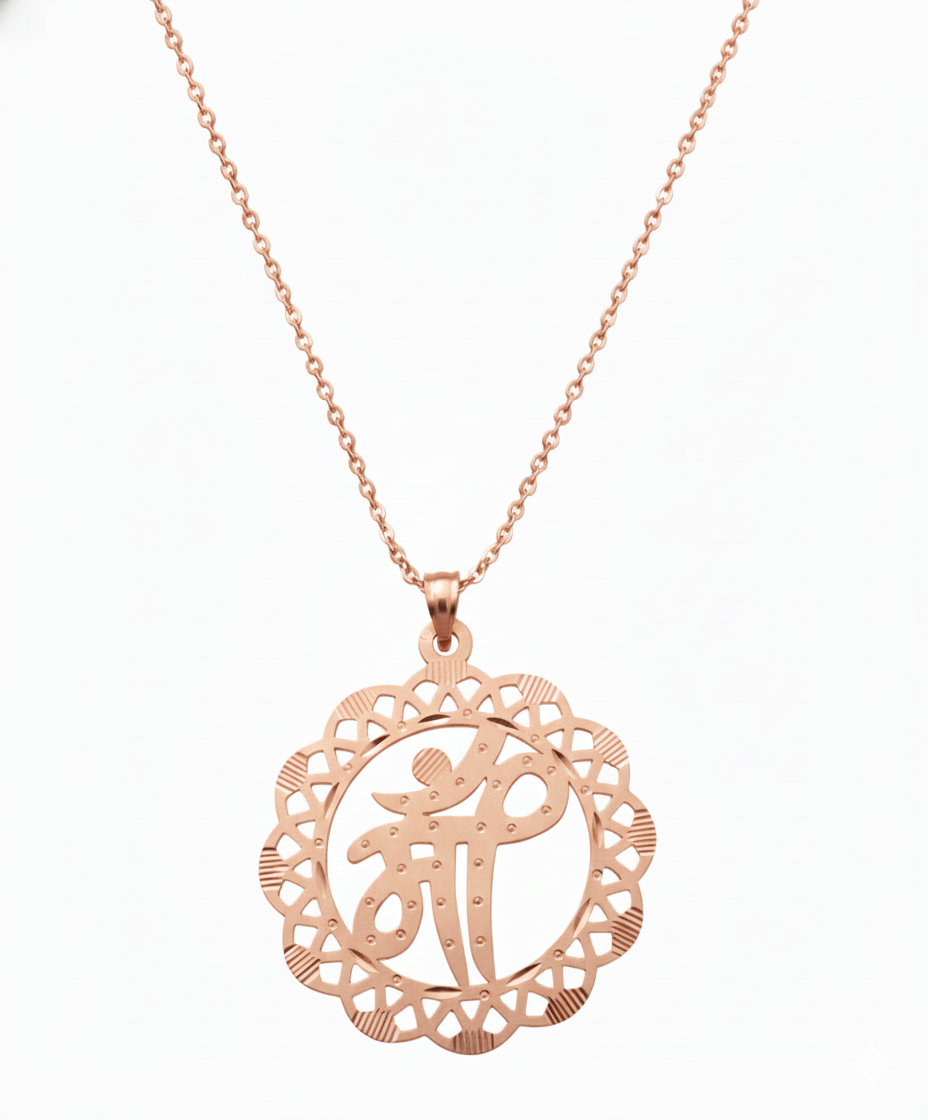Rose gold mandala letter pendant showing detailed stone cut craftsmanship.