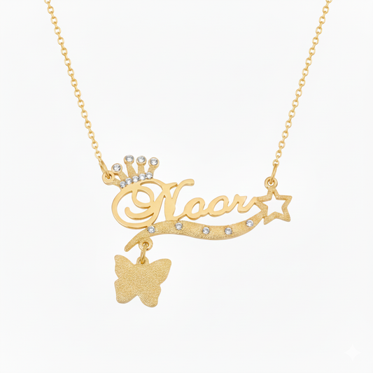 Personalized name necklace with a studded crown and butterfly in gold plating.