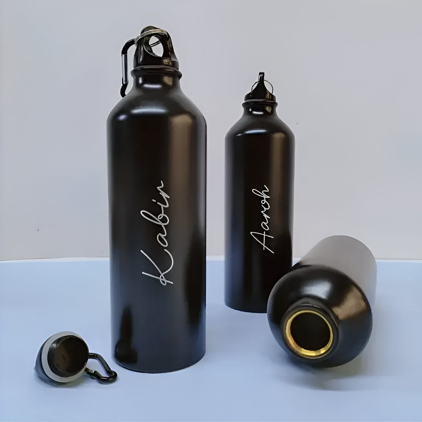 Custom white print on 750 ml matte-black sipper bottle – ideal for gym, office, or travel
