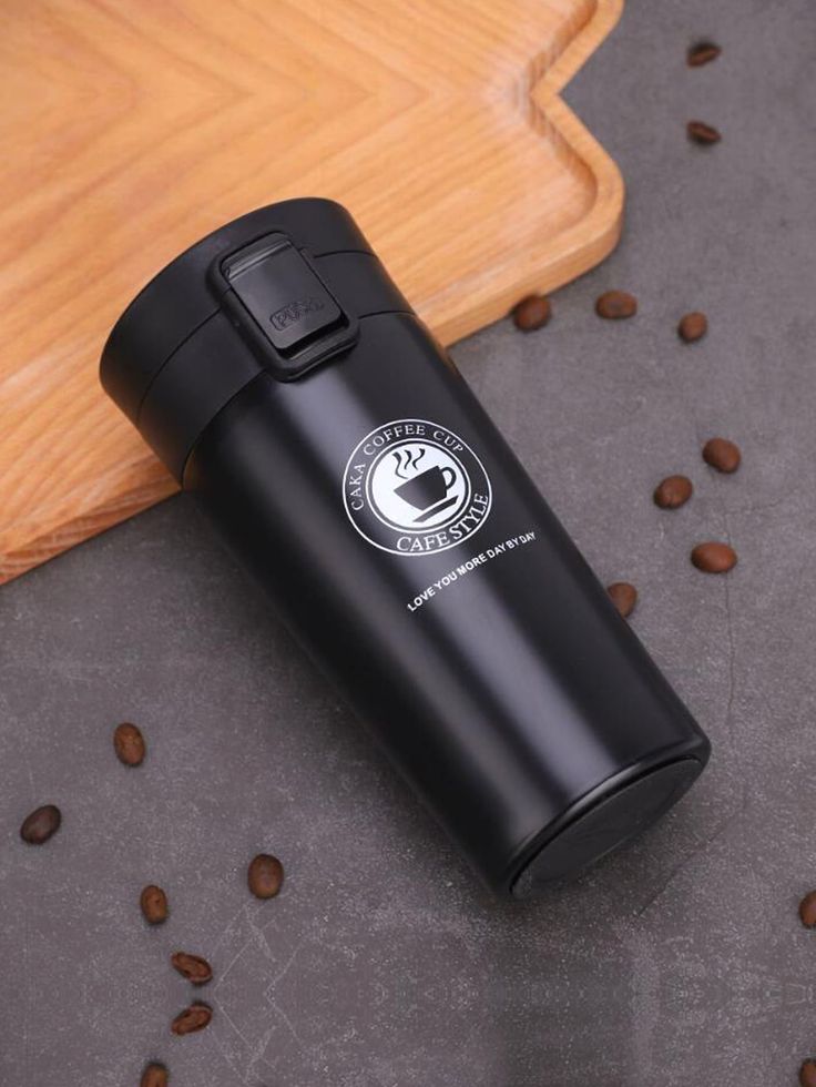 Desk setup with SleekSip custom travel mug and laptop, showcasing name-print branding