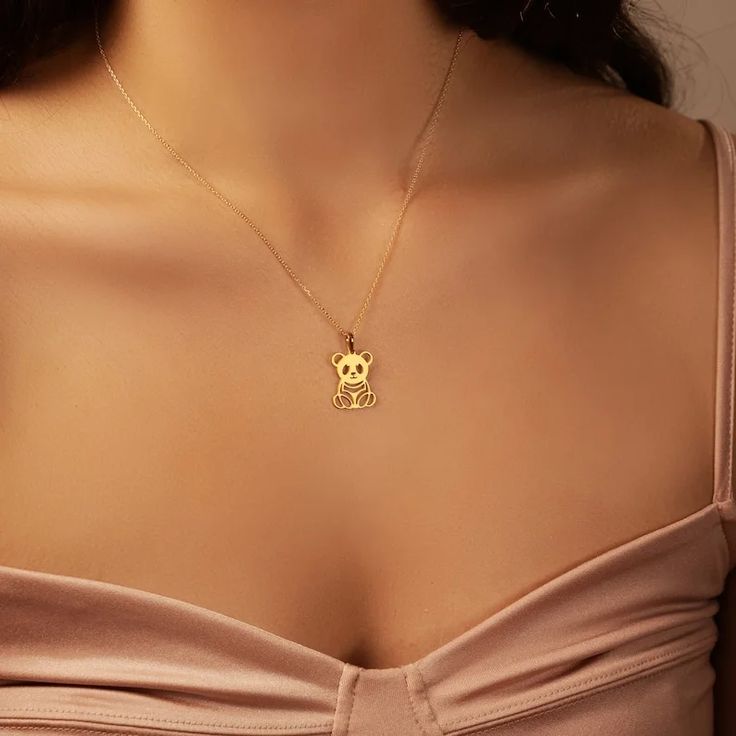 Elegant gold panda outline pendant hanging on fine chain