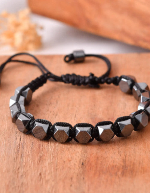 Adjustable men's hematite bead bracelet with cross pendant
