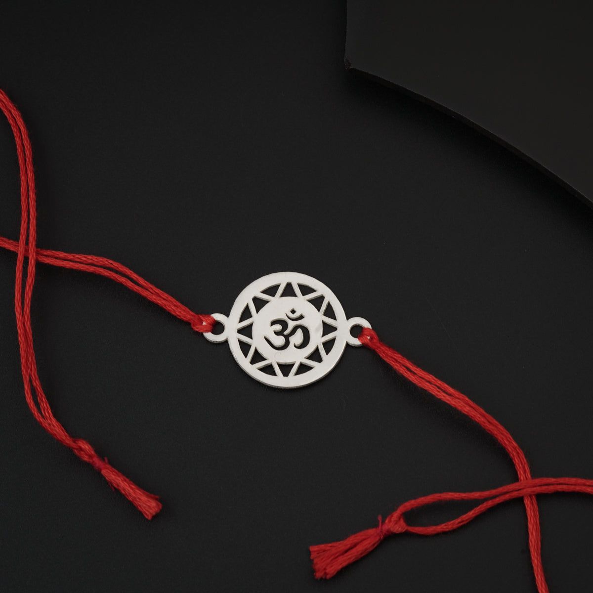 Personalized Rakhi for brother with laser cut charm and traditional thread